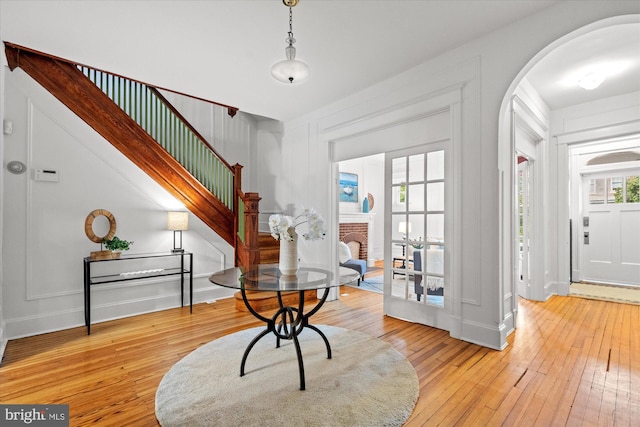 2637 Garfield St NW, Washington, DC 20008 - entrance foyer featuring arched walkways, hardwood / wood-style flooring, and stairway