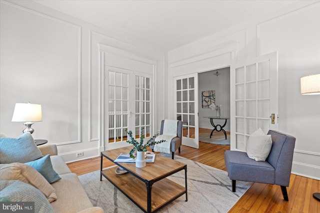 2637 Garfield St NW, Washington, DC 20008 - living room with french doors, wood finished floors, and a decorative wall