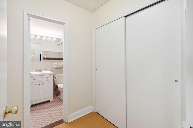 2101 Chestnut St Unit 909, Philadelphia, PA 19103 - half bath with vanity and wood finished floors