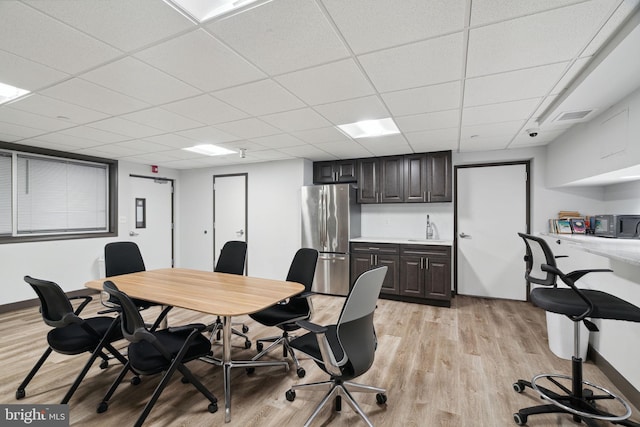 2101 Chestnut St Unit 909, Philadelphia, PA 19103 - dining space featuring a paneled ceiling, light wood-style floors, and a desk