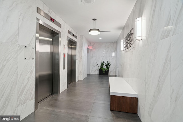 2101 Chestnut St Unit 909, Philadelphia, PA 19103 - corridor with tile walls and elevator