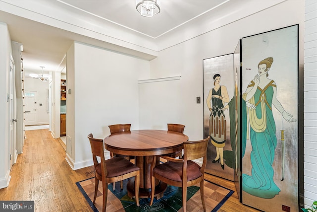 423 5th St SE, Washington, DC 20003 - dining room featuring light wood-style floors and a chandelier