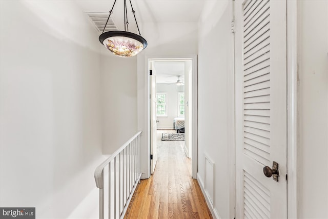 423 5th St SE, Washington, DC 20003 - corridor featuring light wood-style flooring and an upstairs landing