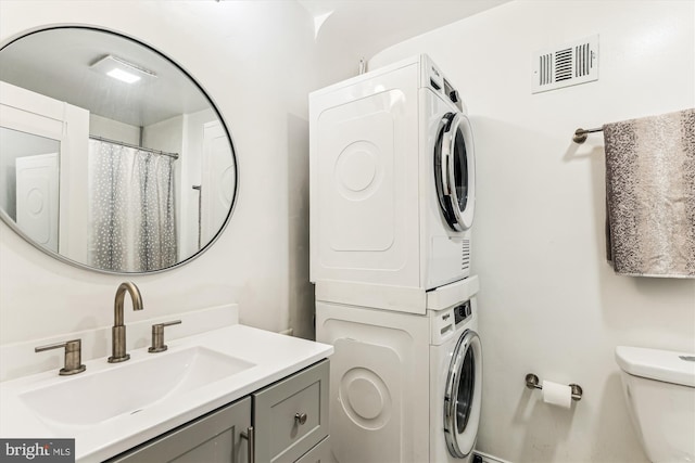 423 5th St SE, Washington, DC 20003 - full bath featuring estacked washer and dryer and vanity