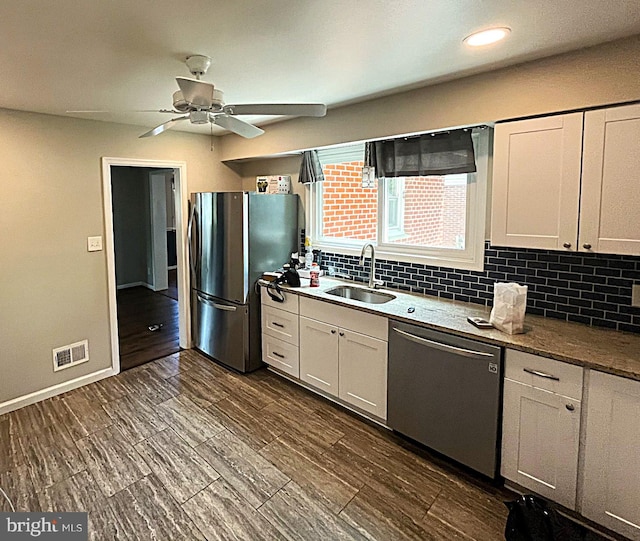 207 Maryland Ave, Newport, DE 19804 - kitchen with appliances with stainless steel finishes, backsplash, ceiling fan, white cabinetry, and recessed lighting