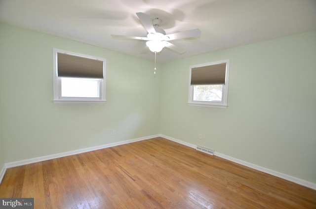 207 Maryland Ave, Newport, DE 19804 - empty room with wood finished floors and a ceiling fan