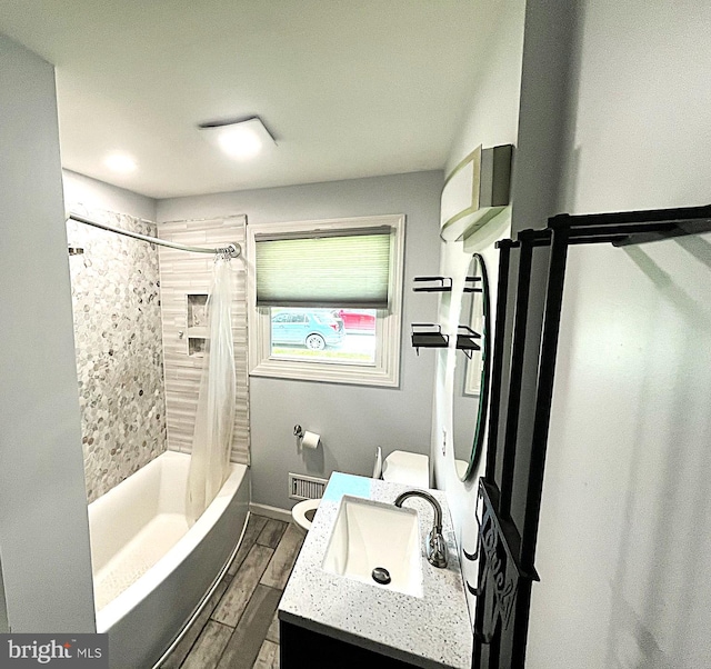 207 Maryland Ave, Newport, DE 19804 - full bathroom with an AC wall unit, vanity, shower / bathtub combination with curtain, and wood finished floors