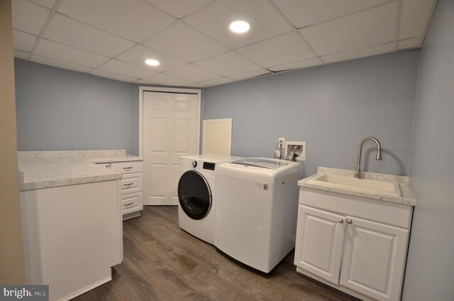 207 Maryland Ave, Newport, DE 19804 - laundry room with washer and clothes dryer, dark wood finished floors, and cabinet space