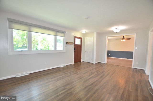 207 Maryland Ave, Newport, DE 19804 - unfurnished living room with ceiling fan and dark wood finished floors