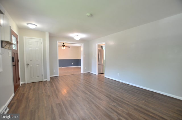 207 Maryland Ave, Newport, DE 19804 - empty room with dark wood-type flooring, a smoke detector, and a ceiling fan