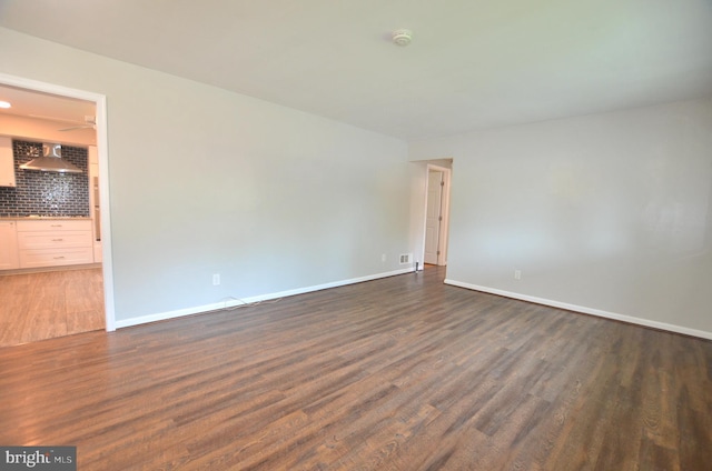 207 Maryland Ave, Newport, DE 19804 - spare room with dark wood-style flooring and a smoke detector