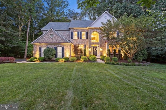 20 Cherry Cir, Glen Mills, PA 19342 - colonial home with a front yard, brick siding, and roof with shingles