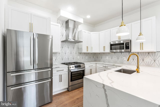 1922 1st St NW Unit B, Washington, DC 20001 - kitchen with appliances with stainless steel finishes, wall chimney range hood, crown molding, white cabinets, and light stone countertops