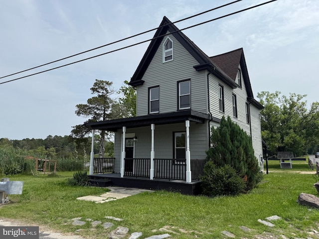 2 Schooner Landing Rd, Millville, NJ 08332 - view of front facade with a porch, a front yard, and a shingled roof