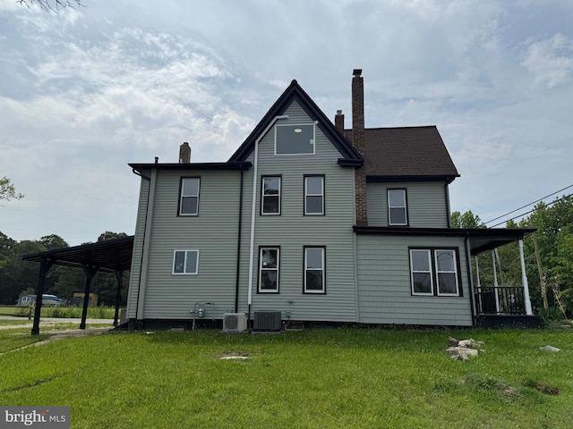 2 Schooner Landing Rd, Millville, NJ 08332 - back of house with a chimney, a yard, and an attached carport