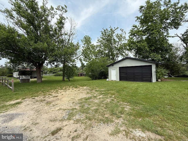 2 Schooner Landing Rd, Millville, NJ 08332 - view of green lawn with a garage and an outbuilding