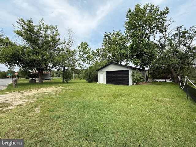 2 Schooner Landing Rd, Millville, NJ 08332 - view of grassy yard featuring a garage and an outbuilding