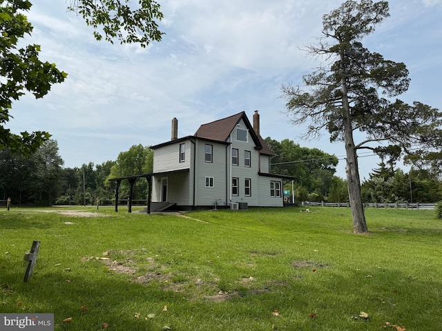 2 Schooner Landing Rd, Millville, NJ 08332 - view of home's exterior featuring a chimney and a lawn