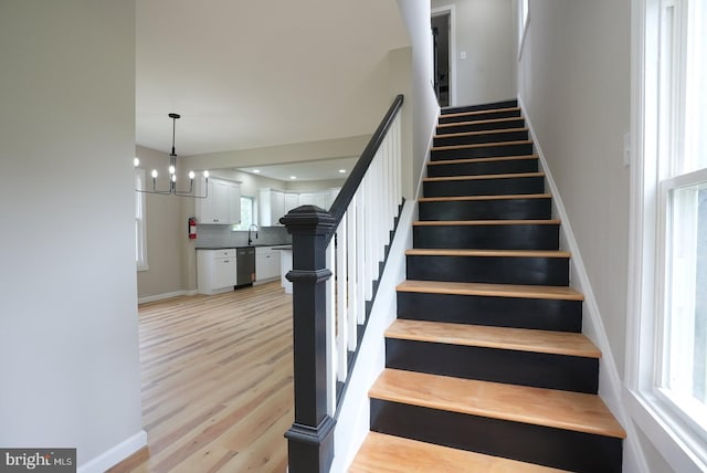 2 Schooner Landing Rd, Millville, NJ 08332 - stairs featuring wood finished floors and a chandelier