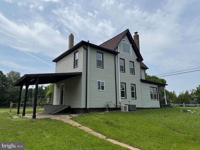 2 Schooner Landing Rd, Millville, NJ 08332 - rear view of house featuring a chimney and a yard