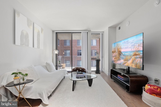 50 Florida Ave NE Unit 404, Washington, DC 20002 - living room featuring floor to ceiling windows and wood finished floors