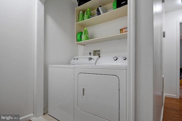 121 Sweetbriar Ln, Winchester, VA 22603 - laundry area featuring washing machine and dryer and light wood-type flooring