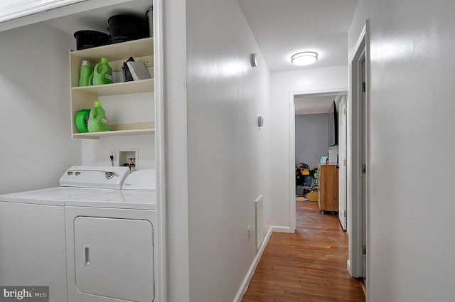 121 Sweetbriar Ln, Winchester, VA 22603 - washroom featuring washer and clothes dryer and wood finished floors