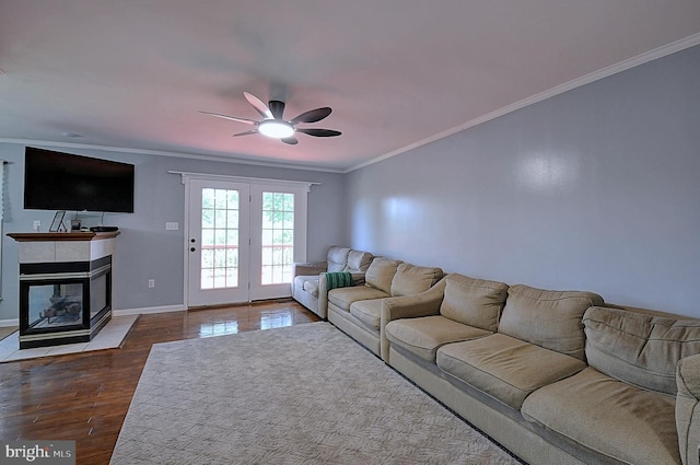 121 Sweetbriar Ln, Winchester, VA 22603 - living area with ceiling fan, crown molding, dark wood-style flooring, and a tiled fireplace