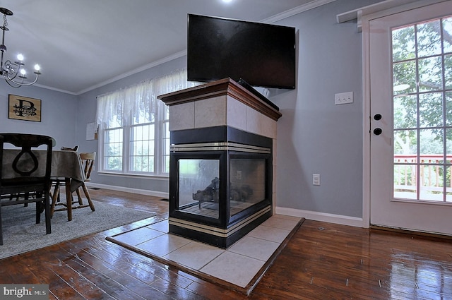 121 Sweetbriar Ln, Winchester, VA 22603 - living room featuring wood-type flooring, crown molding, a chandelier, and a fireplace