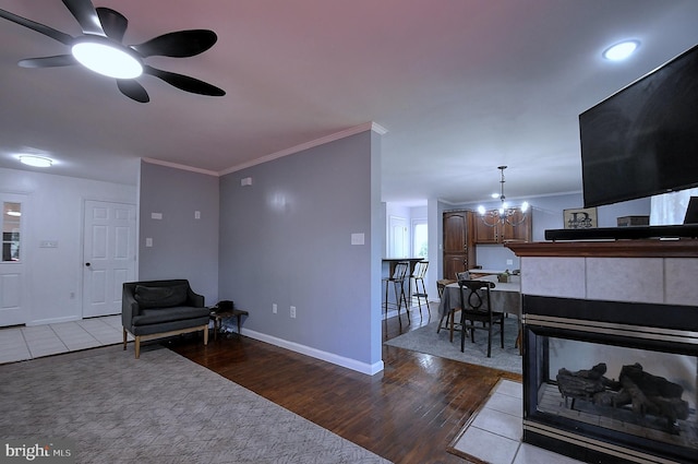 121 Sweetbriar Ln, Winchester, VA 22603 - living room with ceiling fan, ornamental molding, a chandelier, and wood finished floors