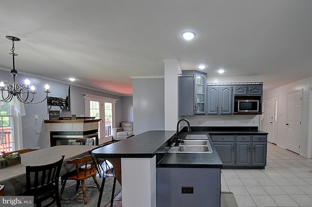 121 Sweetbriar Ln, Winchester, VA 22603 - kitchen featuring dark countertops, gray cabinetry, stainless steel microwave, crown molding, and recessed lighting