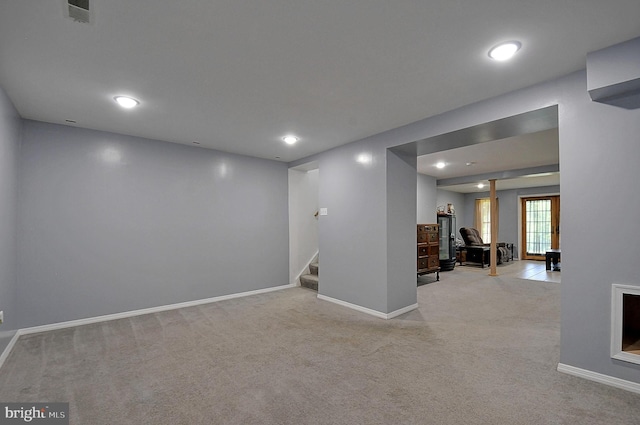 121 Sweetbriar Ln, Winchester, VA 22603 - spare room featuring light colored carpet, stairway, and recessed lighting