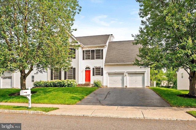 9 Hedgecroft Dr, Pennington, NJ 08534 - view of front facade with asphalt driveway, a shingled roof, and a front yard