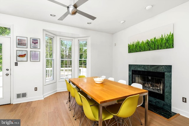 9 Hedgecroft Dr, Pennington, NJ 08534 - dining space with a premium fireplace, plenty of natural light, ceiling fan, light wood finished floors, and recessed lighting