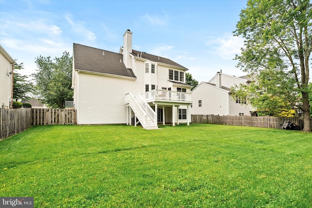 9 Hedgecroft Dr, Pennington, NJ 08534 - back of property with stairway, a fenced backyard, a deck, a chimney, and a shingled roof