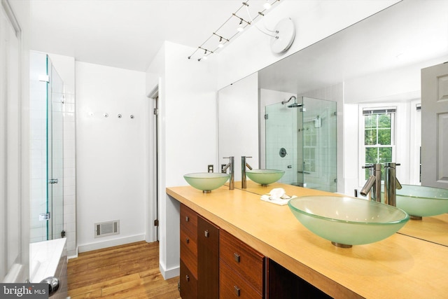 9 Hedgecroft Dr, Pennington, NJ 08534 - full bath featuring a stall shower, double vanity, and wood finished floors