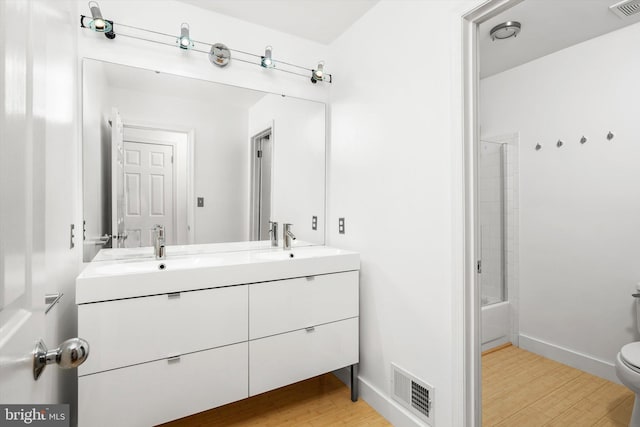 9 Hedgecroft Dr, Pennington, NJ 08534 - full bathroom featuring double vanity, wood finished floors, and bathing tub / shower combination