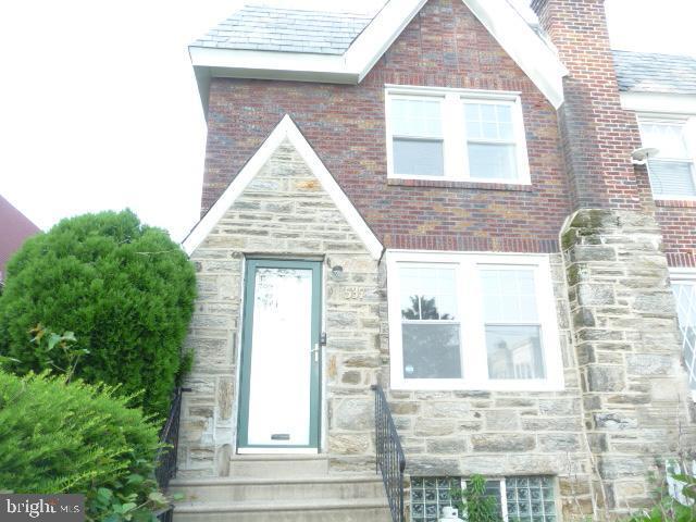 537 E Comly St, Philadelphia, PA 19120 - tudor home with stone siding and brick siding
