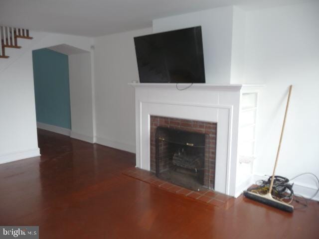 537 E Comly St, Philadelphia, PA 19120 - living room with a tiled fireplace and wood finished floors
