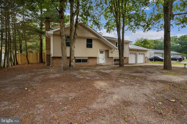 470 E Taunton Ave, West Berlin, NJ 08091 - view of front of property with a chimney, an attached garage, and dirt driveway