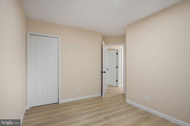 470 E Taunton Ave, West Berlin, NJ 08091 - unfurnished bedroom featuring light wood finished floors and a closet
