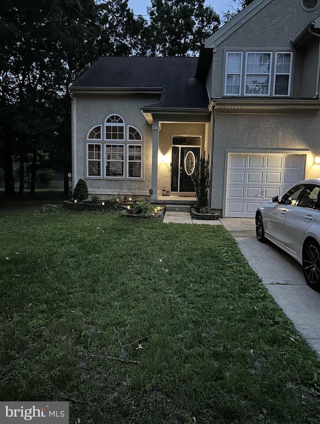 30 Cross Hill Rd, Sicklerville, NJ 08081 - view of front of home featuring a front lawn, a garage, stucco siding, and driveway