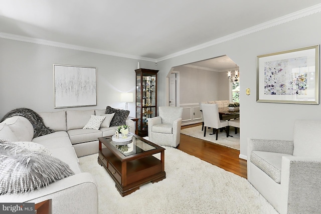 11166 Deuaughn Ct, Fairfax Station, VA 22039 - living room with wood finished floors, ornamental molding, and a chandelier