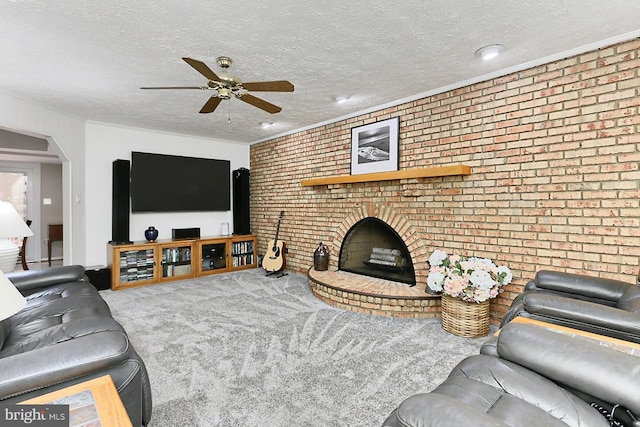 11166 Deuaughn Ct, Fairfax Station, VA 22039 - carpeted living area with a ceiling fan, brick wall, a textured ceiling, and a brick fireplace