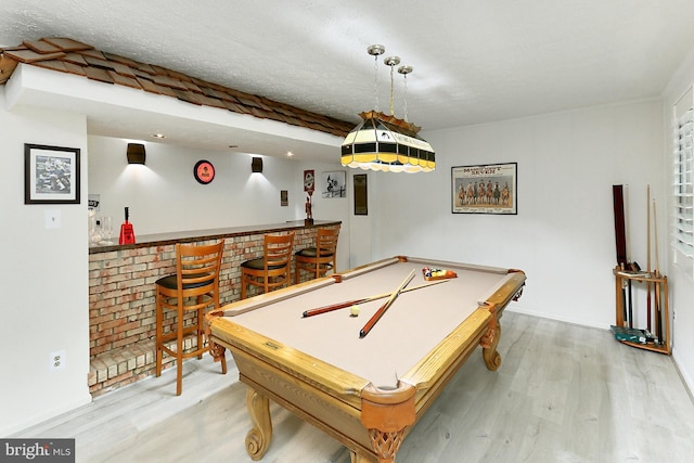 11166 Deuaughn Ct, Fairfax Station, VA 22039 - game room featuring a bar, wood finished floors, billiards table, and a textured ceiling