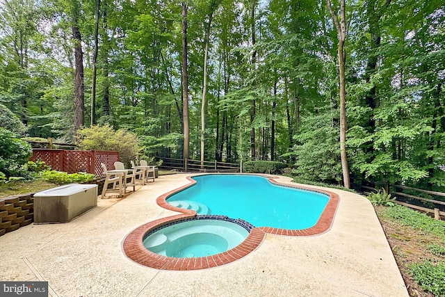 11166 Deuaughn Ct, Fairfax Station, VA 22039 - view of pool featuring a patio, a pool with connected hot tub, and a fenced backyard