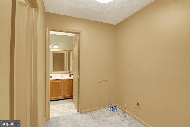 22 Piston Ct, Stewartstown, PA 17363 - laundry area featuring light colored carpet and a sink