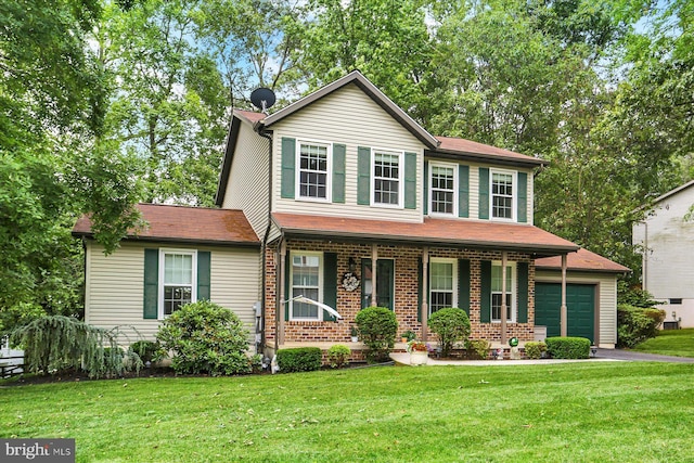 22 Piston Ct, Stewartstown, PA 17363 - view of front of house featuring covered porch, an attached garage, and a front yard