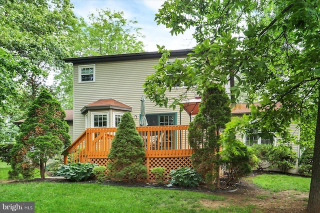 22 Piston Ct, Stewartstown, PA 17363 - rear view of house featuring a wooden deck and a yard