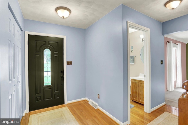 22 Piston Ct, Stewartstown, PA 17363 - entryway featuring light wood finished floors and baseboards